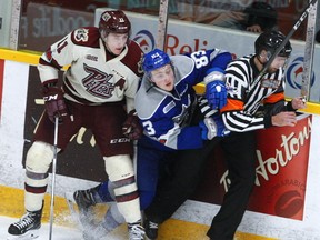 Peterborough Petes' Zach Gallant checks Sudbury Wolves' Zack Malik into a referee during second period OHL action on Thursday December 7, 2017 at the Memorial Centre in Peterborough, Ont. CLIFFORD SKARSTEDT/PETERBOROUGH EXAMINER