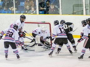 Sarnia Legionnaires goalie Blair Coffin blocks a shot with his stick during a wild scramble in front of his net Thursday. Coffin earned his first shutout of the year as the Legionnaires blanked the LaSalle Vipers 1-0.

Photo courtesy of Shawna Lavoie