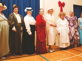 The annual Christmas dinner was held at the Cultural-Recreational Centre (CRC) Friday to thank the volunteers, staff and board members for all their hard work for the Vulcan and Region Food Bank Society.  Here, Women line up in costume for the best costume judging. Georgia-Lee Debolt, third from left, was the winner.