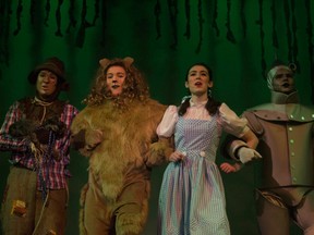 The Scarecrow (Gareth Davies), Cowardly Lion (Zach Betts), Dorothy (Holly Crowson) and Tin Man (Pat Tidman) are shown in a scene from Regiopolis-Notre Dame Catholic High School's production of The Wizard of Oz.