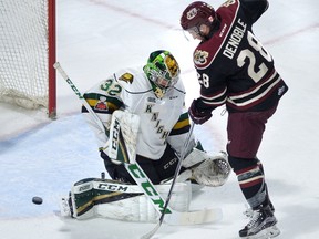 London Knights goaltender Joseph Raaymakers makes a save on Peterborough Petes forward Logan Denoble during first period Ontario Hockey League action Friday at Budweiser Gardens. (MORRIS LAMONT, The London Free Press)