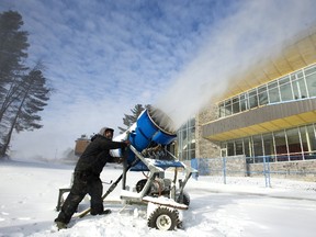 Phil English a lift mechanic at Boler Mountain redirects one of their big snow jets as the season of snowmaking kicks off this week in London, Ont. Shaun Bonnallie, the manager of outdoor operations said next weeks forecast of colder nights should allow them to make more snow, more efficiently, "we like to see it -6 and below, then we can really amp up the production numbers." (MIKE HENSEN, The London Free Press)