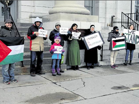 The humble beginnings of the Hands Off Jerusalem rally held in front of City Hall on Saturday, Dec. 9, in Kingston. The crowd grew larger as the rally went on. (Steph Crosier/The Whig-Standard)