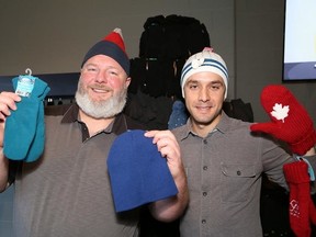 Ken Wilson, left, co-ordinator of All Nations Church Mountain of Mittens campaign, and John Argento, of Interpaving Ltd., helped to launch the campaign at All Nations Church on Tuesday, Nov. 21, 2017. All Nations is one of four downtown Sudbury churches that are each undertaking special Advent collection projects in December that will make Christmas merrier for our community’s most vulnerable citizens. (John Lappa/Sudbury Star)