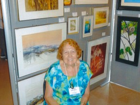 Marlis Saunders sits in front of her watercolour paintings during an exhibition at Kleinburg's McMichael Gallery in October. Scores of the Sarnia woman’s paintings will be on display during December and January at Sarnia's R.W. Lawton Gallery.
Handout/Sarnia This Week