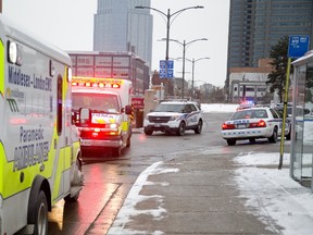 Police were at the scene where a woman was stabbed in the abdomen near Wellington and Horton streets in London, Ont. just before 4 p.m. on Sunday December 10, 2017. (MIKE HENSEN, The London Free Press)