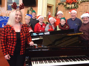 Members of the choir at Central United Church -- including, from left, music director Lauri Ladd, Sandy Westaway, Cal Thompson, Liz Tofflemire, Evelyn Lanning, Terry Lanning, Betty Field, Dave Mathers, and Dave Wilson -- will pitch in this Saturday for the 12 Hours of Christmas, a music marathon for Inn Out of the Cold. Admission for the event is by free will donation and will go towards supporting the local shelter. (Louis Pin/Times-Journal)