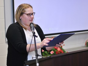 Kent Federation of Agriculture director Katrina Sterling accepts the Ed Campbell Memorial Award for Director of the Year during the KFA's annual general meeting at the Ridgetown Campus of the University of Guelph on Dec. 7.