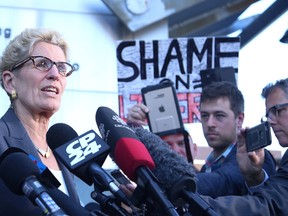 Premier Kathleen Wynne speaks to media at a courthouse in Sudbury, Ont. on Wednesday September 13, 2017. Gino Donato/Sudbury Star/Postmedia Network