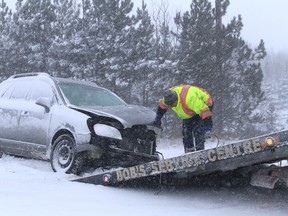 A collision involving a vehicle and a transport closed the Lasalle extension near Frood Road in Sudbury, Ont. for a short time on Tuesday morning. Another vehicle unrelated to the collision, was also in the ditch not far from the collision. John Lappa/Sudbury Star/Postmedia Network