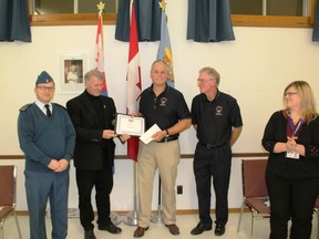 Capt. G. Mainville (left) stands as St. Clair Township Mayor Steve Arnold presents a certificate of appreciation and a cheque for $500 to 403 Honour Flight Pilots Mark Seibutis and Rick West. Seibutis and West later presented the cheque to 44 Sarnia Imperial Squadron Air Cadets' Melody Gibson.
Handout/Sarnia This Week