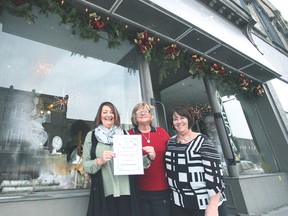 From the left is Looking Glass owner, Shelley McMillan. She recently won the best Christmas decorated storefront, a competition put together by the Seaforth BIA . (Shaun Gregory/Huron Expositor)