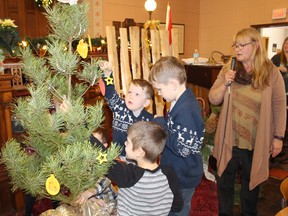 Lucknow United Church held the Sunday School Pageant on Sunday December 10, 2017 which highlighted the symbols of Christmas. Children and all in attendance participated in identifying the symbols as the children placed them on or around the Christmas tree. The children of the Lucknow Sunday School made butterfly hand paintings that would be kept in the church for years to come. Pictured: Ayden James and his brother Emmett hang symbols of Christmas on the Christmas tree and Ethan Mali, as Rev. Lynne Wilson looks on.