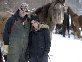 Andy and Sharon Russell with Zydeco at Century Farms in Mt. Brydges. On Sunday afternoon they found a horse named Tage had suffered a bullet wound and had to be euthanized. (DEREK RUTTAN, The London Free Press)