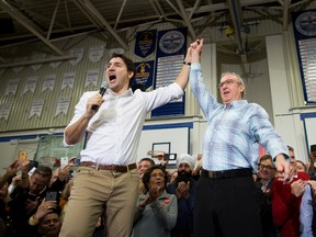 Prime Minister Justin Trudeau, left, and South Surrey-White Rock Liberal byelection candidate Gordie Hogg attend a rally in Surrey, B.C., on Saturday, December 2, 2017. THE CANADIAN PRESS/Darryl Dyck