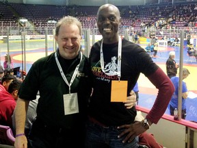 John Burke, left, of the Sarnia/Bluewater Wrestling Club is coaching Kevin Wallen of Kingston, Jamaica, at the Commonwealth wrestling championships this week in South Africa. (Contributed Photo)