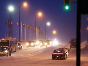 Gino Donato/Sudbury Star/Postmedia Network
Motorists make their way over the Bridge of Nations in Sudbury on Tuesday. Greater Sudbury Police report that the road conditions had not improved since Tuesday morning. The roads are still extremely icy, snow covered and visibility is poor. Please slow down, police advised. Intersections and hills are icy making it difficult for vehicles to stop quickly. Leave extra room between cars, police said. See related story on page A3.