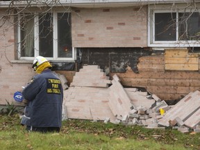 Clive Hubbard, a fire investigator for the Ontario Fire Marshal is investigating an explosion and house fire at 1335 Hamilton Rd. in London, Ont. (MIKE HENSEN, The London Free Press)