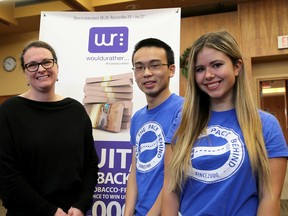 Nicole Szumlanski, left, of the Kingston, Frontenac, Lennox & Addington Public Health with Queen's students Joseph Lee and Jennifer Dal Cin promoting the WouldURather smoking cessation contest. (Ian MacAlpine/The Whig-Standard)