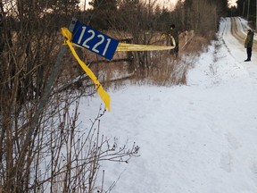 Police put up yellow caution tape at the scene of a Hydro One helicopter crash on Thursday, Dec. 14, 2017. Meghan Balogh/Postmedia Network