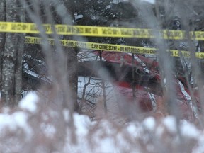 The crashed Hydro One helicopter at the crash site near Tweed, Ont., about 95 kilometres east of Peterborough, on Dec. 14, 2017. Four Hydro One employees were killed Thursday in the crash, police and the utility reported. The crash occurred around noon in Tweed. THE CANADIAN PRESS/Lars Hagberg