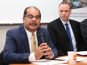 Amin Visram, left, CEO of Vista Hospitality, makes a point as Robert Green, project co-ordinator for Vista Hospitality, looks on during a media conference at the Rainbow Centre in Sudbury, Ont. on Thursday December 14, 2017. John Lappa/Sudbury Star/Postmedia Network