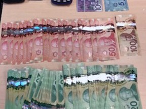 Cash, scale and cell phones seized by Kingston Police from two Ottawa women in Kingston, Ont. on Thursday December 14, 2017. Supplied photo