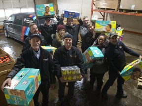 Burwell Auto Body organized a food drive for the London Food Bank and challenged several companies it deals with to donate as well. The drive brought in 7,746 pounds of food and diapers. (MIKE HENSEN, The London Free Press)
