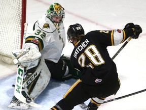 London Knights goaltender Joseph Raaymakers makes a save on a deflection by Kelton Hatcher of the Sarnia Sting in an Ontario Hockey League game on Friday night at Budweiser Gardens. (MIKE HENSEN, The London Free Press)