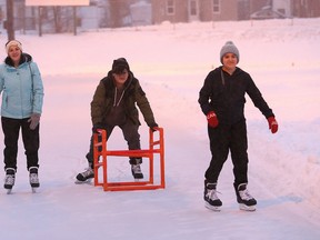 John Lappa/Sudbury Star/Postmedia Network
Jennifer Cobersky, left, and her children, Kaillum, 13, and Lola, 11, skate at the Queen's Athletic Field skating oval on Friday. The skating surface is open for the season. Hours of operation are Monday to Friday from 4 p.m. to 10 p.m. and Saturday and Sunday from Noon until 10 p.m. The oval will be closed on Christmas day and New Year's day. The facility will feature extended hours during the holiday season from Jan. 2 to Jan. 5, operating hours will be from noon to 10 p.m. Regular hours will resume on Jan. 6.