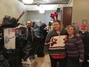 Volunteers at LifeSpin, a local agency working to support and empower low-income families, organized 1,200 Christmas packages on Saturday. Individuals and groups that want to donate are matched with a family in need, and asked to buy one gift for each child based on a personalized wish list. (MEGAN STACEY/The London Free Press)