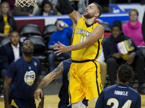 Garret Williamson takes flight to score two points during the London Lightning's victory over the St. John's Edge, 116-103, in London, Ont. on Sunday December 17, 2017. (DEREK RUTTAN, The London Free Press)