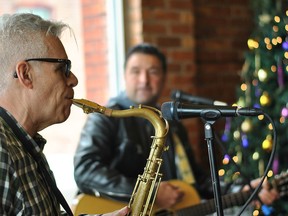 Kelly "Mr. Chill" Hoppe and Jody Raffoul from The S'Aints perform at the William Street Cafe in Chatham Friday. The band releases a CD and performs a concert in Windsor every holiday season to raise funds for various charities, including Chatham's Outreach for Hunger.