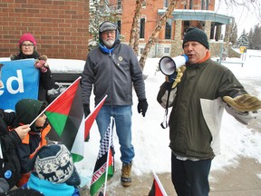 Chatham-Kent Muslim Association president Hassan El Khodr, right, speaks during a Hands off Jerusalem rally at the Municipality of Chatham-Kent Civic Centre on Saturday. El Khodr said U.S. President Donald Trump's declaration of Jerusalem as the capital of Israel has led to more violence in the Middle East.