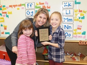 YMCA president Kathi Lomas McGee celebrates with two P.E. McGibbon Beyond the Bell students following a plaque presentation on Dec. 8.
CARL HNATYSHYN/SARNIA THIS WEEK
