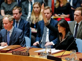 US Ambassador to the UN Nikki Haley raises her hand as opposed to the vote on a draft resolution that would reject US President Donald Trump's decision to recognize Jerusalem as the capital of Israel during a meeting on the situation in the Middle East including Palestine on December 18, 2017, at UN Headquarters in New York. KENA BETANCUR/AFP/Getty Images