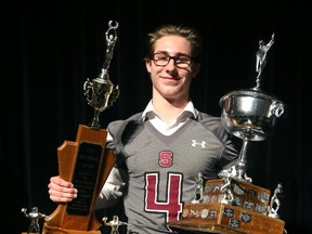 For the second year in a row, South quarterback Ethan Martin carried home the Bob Gooder trophy for MVP and the Greg Anderson Memorial trophy for academics at the annual high school awards ceremony Monday at Central Secondary School in London. (MIKE HENSEN, The London Free Press)