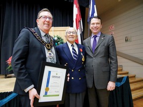 Marc Trouyet, Consul General, from the Consulat General de France in Toronto, on the right, presented the Legion d'Honneur to Harry M. Sanders, (centre) now residing in Tillsonburg, at the Tillsonburg Community Centre Thursday night. Tillsonburg Mayor Stephen Molnar (left) presented a certificate of recogntion to Sanders on behalf of the Town of Tillsonburg to mark the occasion. Sanders, a first class radio operator in the British Merchant Navy, took part in the D-Day landings at Normandy. (Chris Abbott/Tillsonburg News)