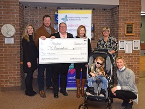 Shelby Sanchuk of the Children's Treatment Centre Foundation of Chatham-Kent, Dan Lundy of Lundy Insurance Inc., Mike Genge of the CTC Foundation, Sarah Lundy of Lundy Insurance, CTC Music Therapist Heather Sarson, Sydney Lundy and Jackie Lundy are shown with a $10,000 cheque Lundy Insurance presented to the CTC Foundation for its music therapy program.