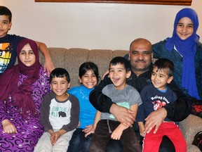 Members of the Al Mohamad family arrived in Mitchell from Lebanon, through Syria, in early March. The family is settling in nicely in their new home on Ontario Road in Mitchell. Pictured recently are Ibrahim (left), 11; mom Shamsa, Hussein, 8; Yasmin, 10; dad Mohamad holding Abdullatif, 4 and Hassan, 2½ and, Karima, 11. ANDY BADER/MITCHELL ADVOCATE