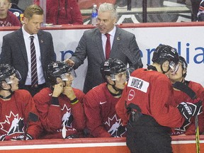 Head coach Dominique Ducharme talks to his players as Canada's National Junior team play Denmark in an exhibition game Friday December 15, 2017 at the Meridian Centre in St. Catharines Ont. (Bob Tymczyszyn, Postmedia News)