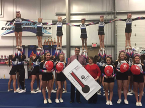 Members of Bluewater Cheer Athletics gather around Jason Killingworth and campaign chairperson Vicki Ducharme to celebrate the United Way of Sarnia-Lambton surpassing its $2-million goal for 2018. Handout/The Observer