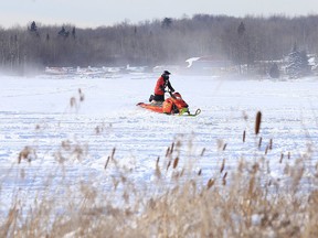 A snowmobiler makes their way across Whitewater Lake earlier this winter. (Gino Donato/Sudbury Star file photo)