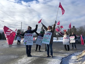 Unionized employees with Frontenac County’s Fairmount Home and marine services hold an information picket about the ongoing contract negotiations in front of the municipality's offices in Glenburnie on Wednesday. (Elliot Ferguson/The Whig-Standard)