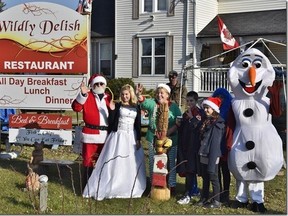 Santa, several fictional characters and some children spread Christmas cheer at Sombra's Wildly Delish Restaurant during the third annual Merrytime Christmas event on Dec. 3. The restaurant was accepting donations of food and clothing to donate to St. Clair Township's Sacred Heart Foodbank until Dec. 23
Handout/Sarnia This Week