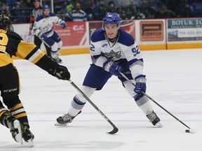 Blake Murray, right, of the Sudbury Wolves, attempts to skate around Benjamin Gleason, of the Hamilton Bulldogs, during OHL action at the Sudbury Community Arena in Sudbury, Ont. on Friday, December 15, 2017. John Lappa/Sudbury Star/Postmedia Network