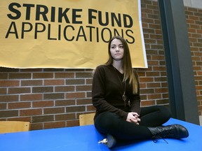 Fanshawe Student Union president Morganna Sampson stands Wednesday at a strike fund application station where students can seek financial help to problems caused by the faculty strike in October and November. (MORRIS LAMONT, The London Free Press)