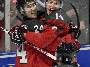 Alex Formenton (a London Knight) (24), Maxime Comtois (14) and Brett Howden celebrate Comtois' first period goal against Team Czech Republic during their World Junior Championship pre-tournament game at Budweiser Gardens in London, Ont. on Wednesday December 20, 2017. Formenton assisted the goal. (Derek Ruttan/The London Free Press)
