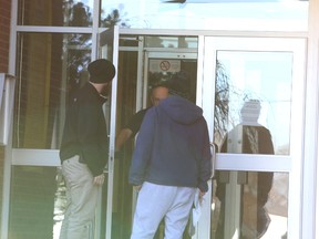 Jason Miller/The Intelligencer
A student, pictured here on the right, is told he can't submit an English assignment due to shelter in place measures being in effect at Quinte Secondary School Thursday morning.