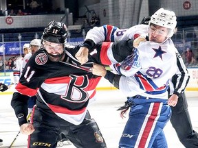 Senators forward Tyler Randell trades blows with Americans foe Garret Ross during a third-period scrap Wednesday night in Rochester. (Rochester Americans photo)